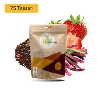 Der Geheimtipp Omas Liebling Tee Verpackung aus Papier mit losem Erdbeere Rhabarber Schwarztee im Hintergrund