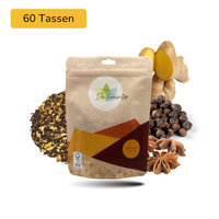 Der Geheimtipp Spicy Chai Tee Verpackung aus Papier mit losem Schwarztee Pfeffer Kardamom Chai Tee im Hintergrund