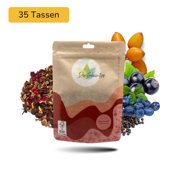 Der Geheimtipp Beerenwald Tee Verpackung aus Papier mit losem Johannisbeere Heidelbeere Hibiskus Früchtetee im Hintergrund