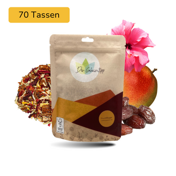 Der Geheimtipp Fruchtflieger Tee Verpackung aus Papier mit losem Rhabarber Mango Dattel Rooibos Tee im Hintergrund