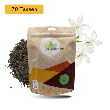 Der Geheimtipp Jasmine Mind Tee Verpackung aus Papier mit losem Jasmintee im Hintergrund